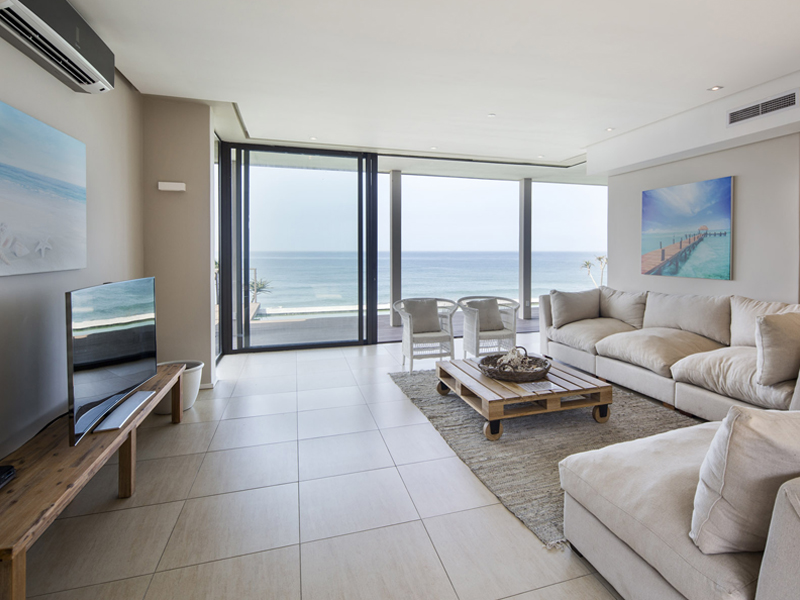 Lounge with seaview at Sovereign Sands the luxurious beach Holiday Villa on the North Coast. This 8 sleeper is the epitome of self-catering excellence, a perfect holiday home.
